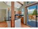 Modern kitchen with stainless steel appliances, granite countertops, and deck access at 10534 Inspiration Dr, Parker, CO 80138