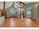 Spacious living room features vaulted ceilings, brick fireplace, and access to the deck at 10534 Inspiration Dr, Parker, CO 80138