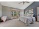 Spacious main bedroom boasts lots of light from bay windows, plush carpet, and high ceilings at 10534 Inspiration Dr, Parker, CO 80138
