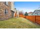 Spacious backyard with a wooden fence and a staircase at 20875 E Girard Pl, Aurora, CO 80013