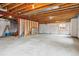Unfinished basement offers a large open space with exposed ceiling and concrete floor at 20875 E Girard Pl, Aurora, CO 80013