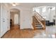 Inviting entryway with hardwood floors, staircase and arched doorway, offers a warm welcome at 20875 E Girard Pl, Aurora, CO 80013