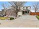 Charming two-story home featuring a brick facade, covered porch, and well-manicured front yard at 20875 E Girard Pl, Aurora, CO 80013
