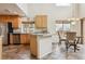 Well-lit kitchen with tile floors, stainless steel appliances, and a cozy breakfast nook at 20875 E Girard Pl, Aurora, CO 80013