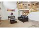 Spacious living room with soaring ceilings, a cozy fireplace, and plenty of natural light at 20875 E Girard Pl, Aurora, CO 80013