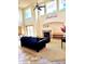 Bright living room featuring high ceilings, fireplace, large windows and a comfortable seating arrangement at 20875 E Girard Pl, Aurora, CO 80013
