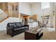 Open-concept living area featuring staircase, kitchen, dining area and vaulted ceilings at 20875 E Girard Pl, Aurora, CO 80013