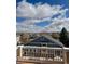 A stunning view of the neighborhood skyline, tree tops, and clouds from the upper deck at 20875 E Girard Pl, Aurora, CO 80013