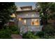Home's backyard features a private deck and staircase, lush landscaping, and a brick-paved walkway at 780 N Lafayette St, Denver, CO 80218