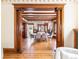Elegant dining room showcasing decorative columns, wooden beams, hardwood floors and modern chandelier at 780 N Lafayette St, Denver, CO 80218