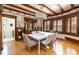 Bright dining room featuring hardwood floors, beamed ceilings, and natural light from large windows at 780 N Lafayette St, Denver, CO 80218