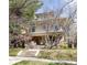 Charming brick two-story home with mature trees and a welcoming front porch, perfect for relaxing or entertaining guests at 780 N Lafayette St, Denver, CO 80218