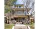 Charming two-story brick home with a welcoming front porch and landscaped front yard at 780 N Lafayette St, Denver, CO 80218