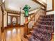 Beautiful foyer with hardwood floors, wooden staircase and trim, creating a grand entrance at 780 N Lafayette St, Denver, CO 80218