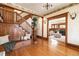 Grand foyer showcasing a wooden staircase, bench, and hardwood floors, exuding classic elegance at 780 N Lafayette St, Denver, CO 80218