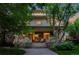 Charming home featuring a welcoming front porch with stone steps and decorative swan planters at 780 N Lafayette St, Denver, CO 80218