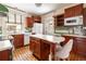 Efficient kitchen features hardwood floors, bright countertops, stainless steel appliances and wood cabinets at 780 N Lafayette St, Denver, CO 80218