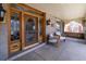 Close-up of front porch featuring elegant entry door, swing, and seating, blending charm with modern comfort at 780 N Lafayette St, Denver, CO 80218