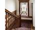 Elegant staircase with wood railings and stained glass window providing natural light at 780 N Lafayette St, Denver, CO 80218