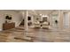 Finished basement featuring wood-look floors, open living area, and modern lighting at 12940 Jasmine St # A, Thornton, CO 80602