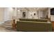 Spacious basement features a seating area, neutral colors, and wood-look floors, offering a cozy retreat at 12940 Jasmine St # A, Thornton, CO 80602
