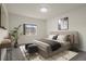 Inviting bedroom featuring a large window, plush bed, and stylish contemporary accents at 12940 Jasmine St # A, Thornton, CO 80602