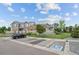 Attractive townhome showcasing stone accents, a tidy yard, and convenient parking at 12940 Jasmine St # A, Thornton, CO 80602
