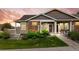 Charming single-story home with stone accents, landscaped front yard, and accessible ramp entrance at 12940 Jasmine St # A, Thornton, CO 80602