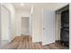 Hallway featuring a laundry closet with a stackable washer and dryer at 12940 Jasmine St # A, Thornton, CO 80602