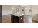 Well-equipped kitchen featuring stainless steel appliances, granite countertops, and a large island at 12940 Jasmine St # A, Thornton, CO 80602