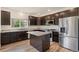Well-equipped kitchen featuring stainless steel appliances, granite countertops, and a large island at 12940 Jasmine St # A, Thornton, CO 80602