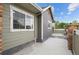 Exterior view of a concrete patio area and siding of home at 12940 Jasmine St # A, Thornton, CO 80602