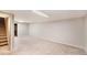 Finished basement with carpet and staircase at 11978 W Aqueduct Dr, Littleton, CO 80127