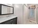 Bathroom features vanity with marble countertop and a sliding door shower at 11978 W Aqueduct Dr, Littleton, CO 80127