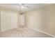 Spacious bedroom features a ceiling fan and a closet at 11978 W Aqueduct Dr, Littleton, CO 80127