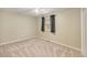 Cozy bedroom with neutral walls, carpet and a ceiling fan at 11978 W Aqueduct Dr, Littleton, CO 80127
