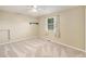 Clean bedroom with neutral walls, carpet and a ceiling fan at 11978 W Aqueduct Dr, Littleton, CO 80127