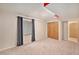 Bedroom with window, closet, and adjoining room at 11978 W Aqueduct Dr, Littleton, CO 80127