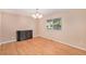 Dining area featuring hardwood floors, a decorative cabinet, and a window with natural light at 11978 W Aqueduct Dr, Littleton, CO 80127