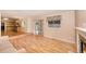 Open living room with wood floors, fireplace, and backyard access at 11978 W Aqueduct Dr, Littleton, CO 80127