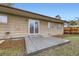 Back exterior features a patio and sliding glass doors with access to the home's interior at 9134 Bellaire St, Thornton, CO 80229