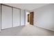 Neutral bedroom featuring a closet with sliding doors at 9134 Bellaire St, Thornton, CO 80229