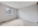 Bedroom featuring neutral walls, carpet and a large window at 9134 Bellaire St, Thornton, CO 80229