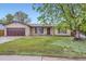 Charming single-story home with a well-maintained front yard and a two car garage at 9134 Bellaire St, Thornton, CO 80229