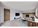 Cozy living room features a brick fireplace and modern furniture at 9134 Bellaire St, Thornton, CO 80229