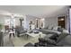 Open living space with a modern color scheme, carpet, and stylish furniture at 9134 Bellaire St, Thornton, CO 80229