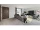 Inviting living room with plush carpeting, modern furnishings, and ample natural light at 9134 Bellaire St, Thornton, CO 80229