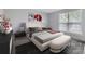 Serene main bedroom featuring a comfortable bed, stylish decor, and a bright window at 9134 Bellaire St, Thornton, CO 80229