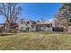 Large grassy backyard with patio, firepit and plenty of room to entertain at 8210 Hoyt Ct, Arvada, CO 80005