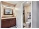 Updated bathroom features a modern vanity, mirror, and a walk-in shower at 8210 Hoyt Ct, Arvada, CO 80005